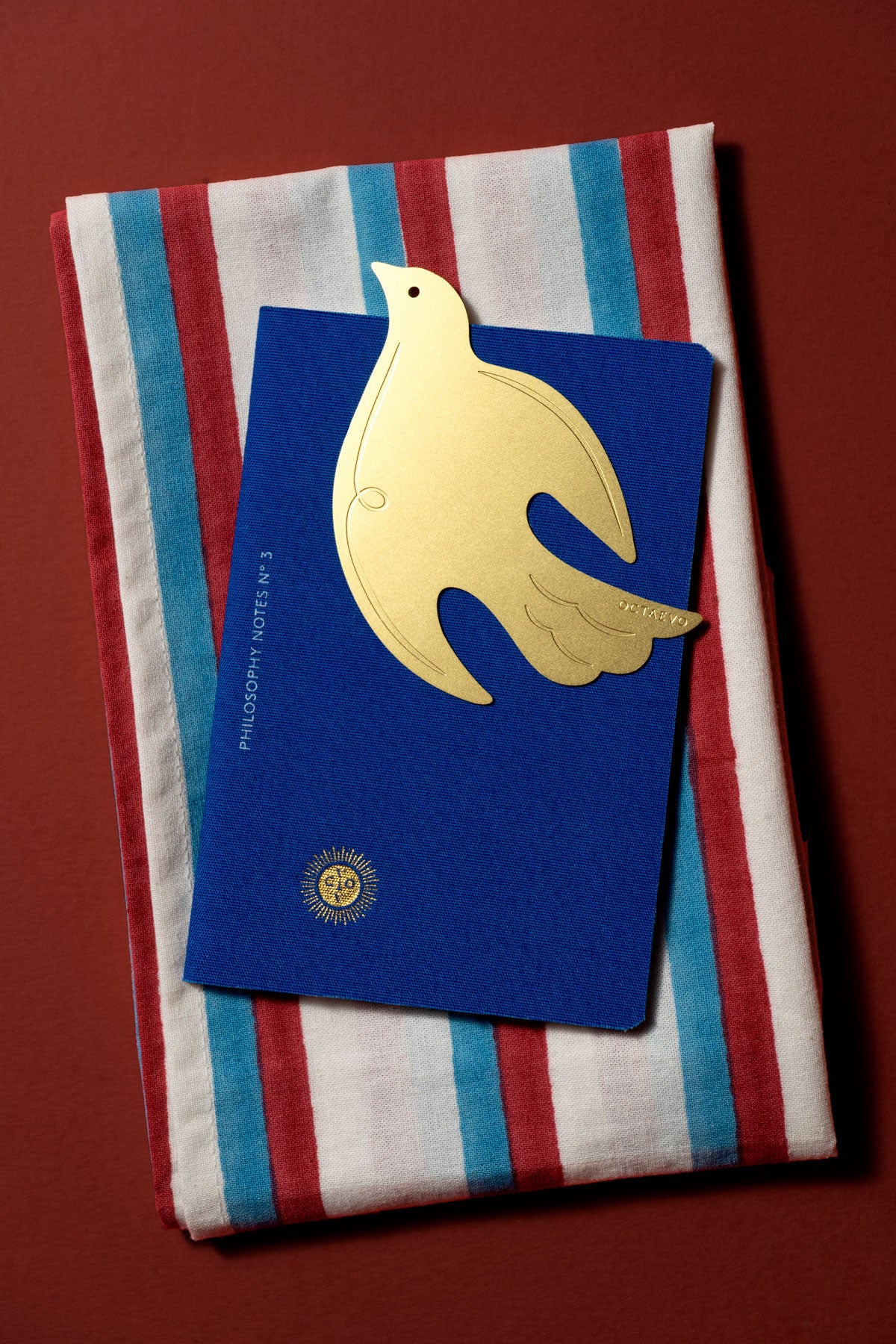 The OCTAEVO Bookmark Paloma, a brass dove bookmark, symbol of peace and hope.