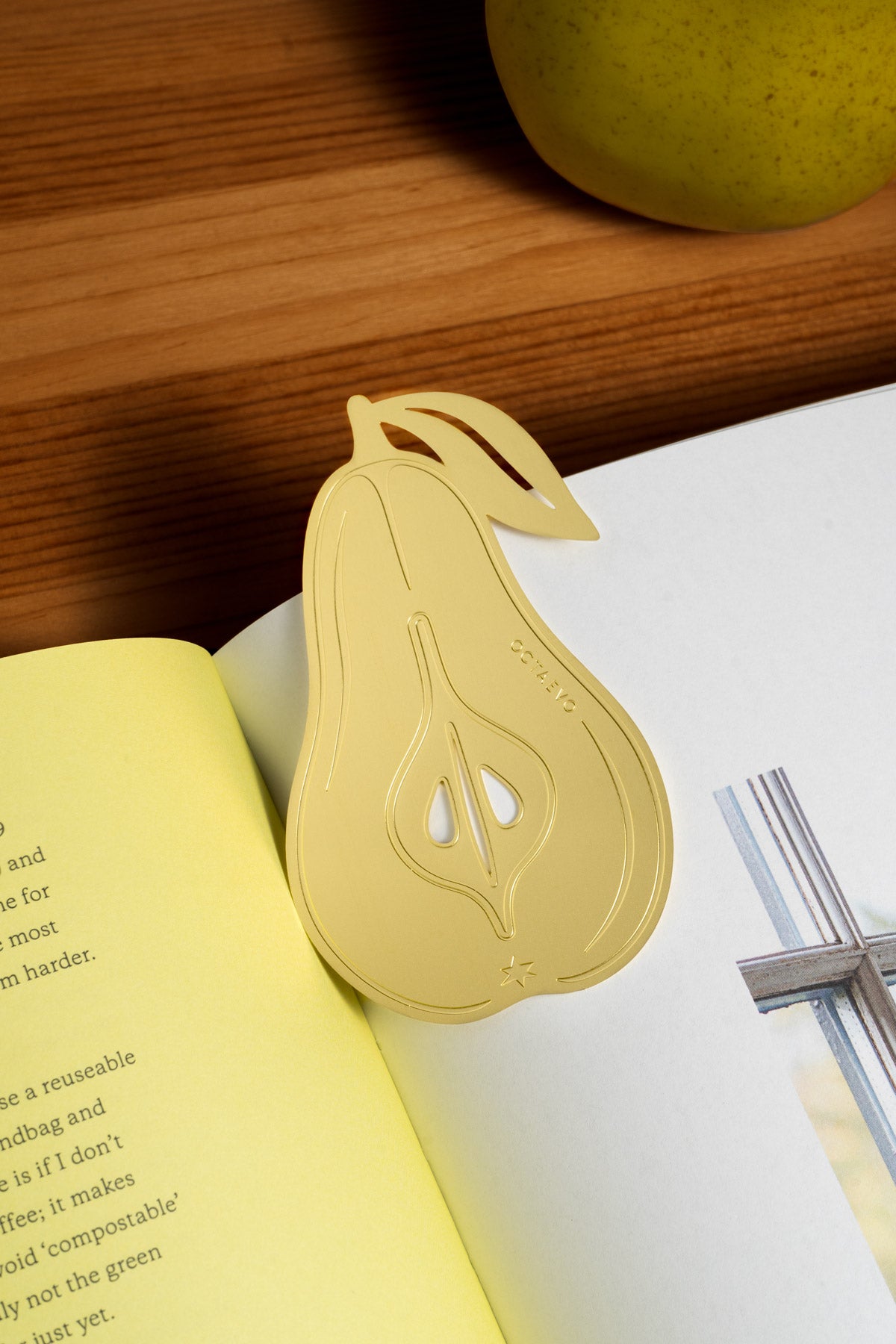 The OCTAEVO Bookmark Pear in finely cut brass, finished with a subtle sheen.