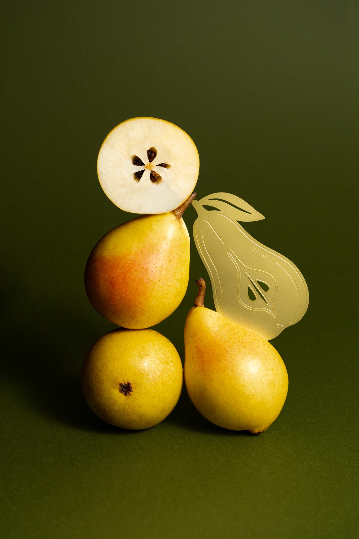 The OCTAEVO Bookmark Pear, a brass bookmark inspired by sun-ripened orchard fruits.