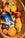 A woven fruit basket, passport notebook, OCTAEVO Bookmark Artemis (gold), Bon Vivant gold and Souvenir gold.