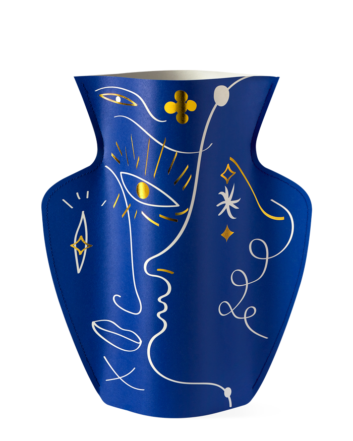 A blue OCTAEVO Jaime Hayon Paper Vase with gold and white abstract face and geometric line drawings.