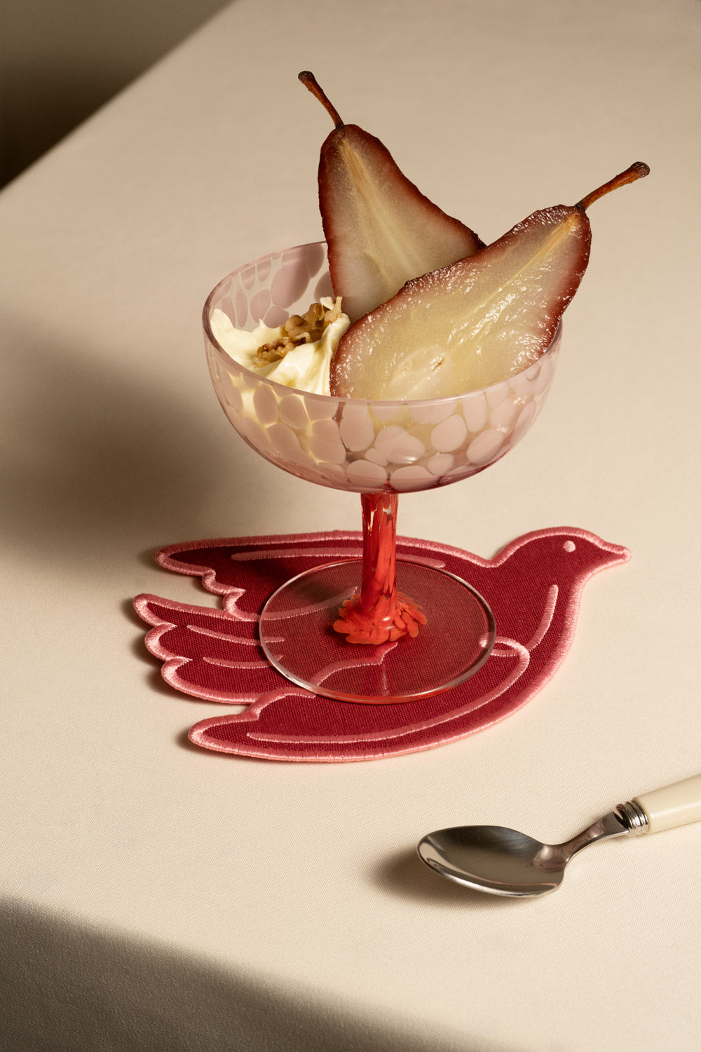 A Paloma coasters in red by OCTAEVO.