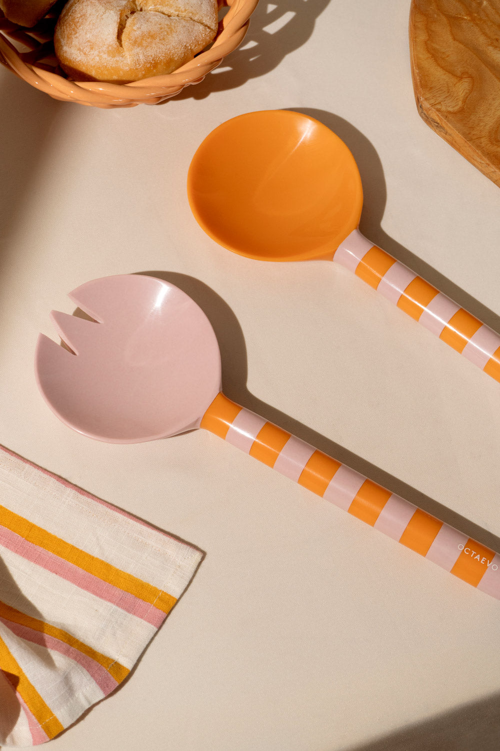 OCTAEVO Salad Servers in orange (Set of 2) with striped handles bring Mediterranean style to your table.