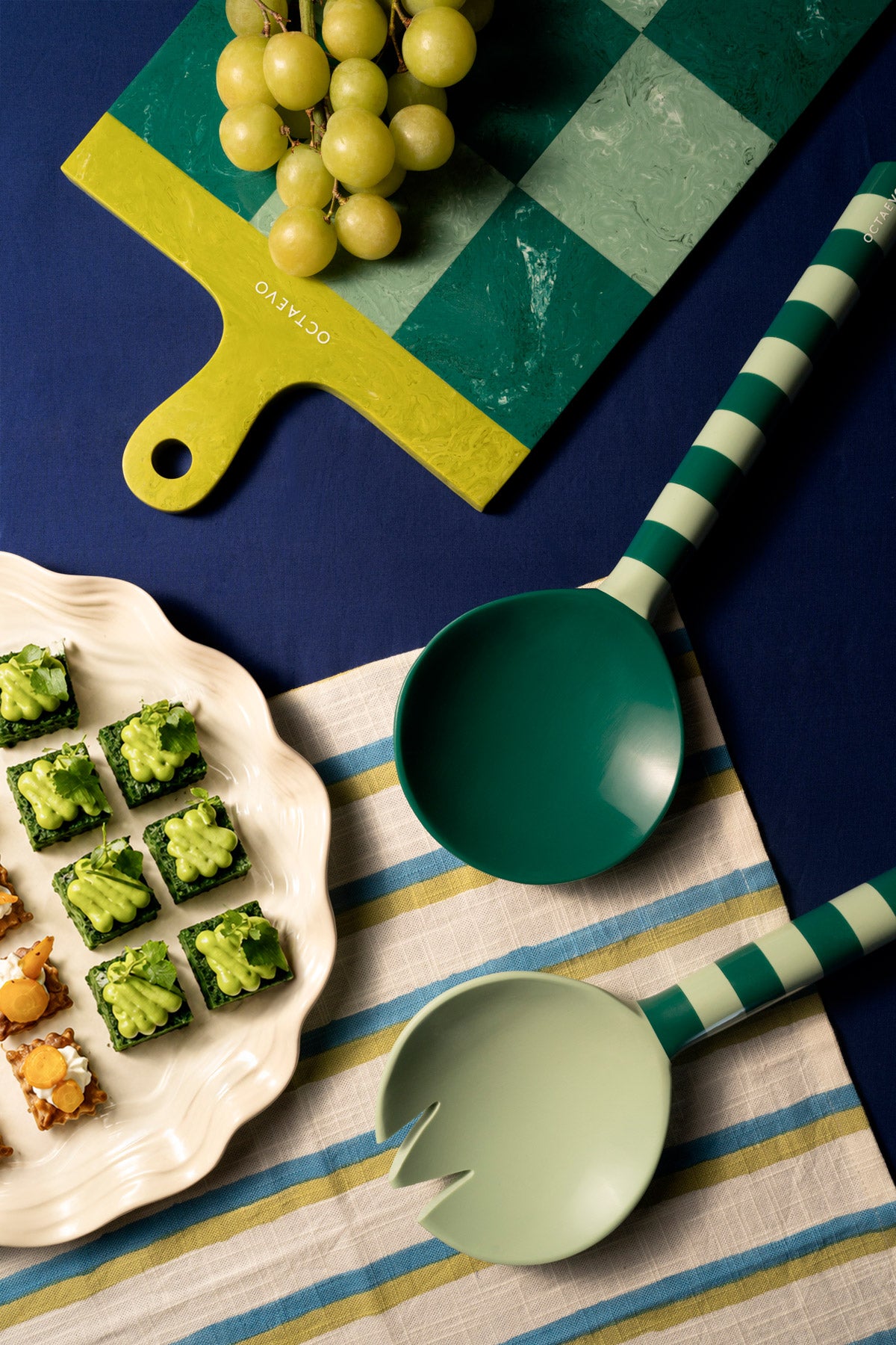 OCTAEVO’s Serving Board in mint on a vibrant blue background.
