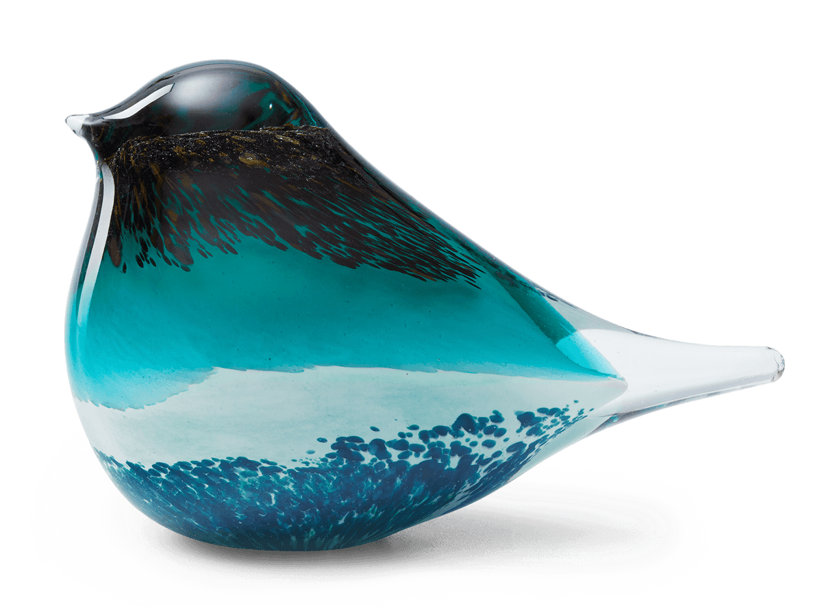 The Atlas Glass Bird by OCTAEVO is a hand-blown green and black glass figurine—an elegant decor piece.