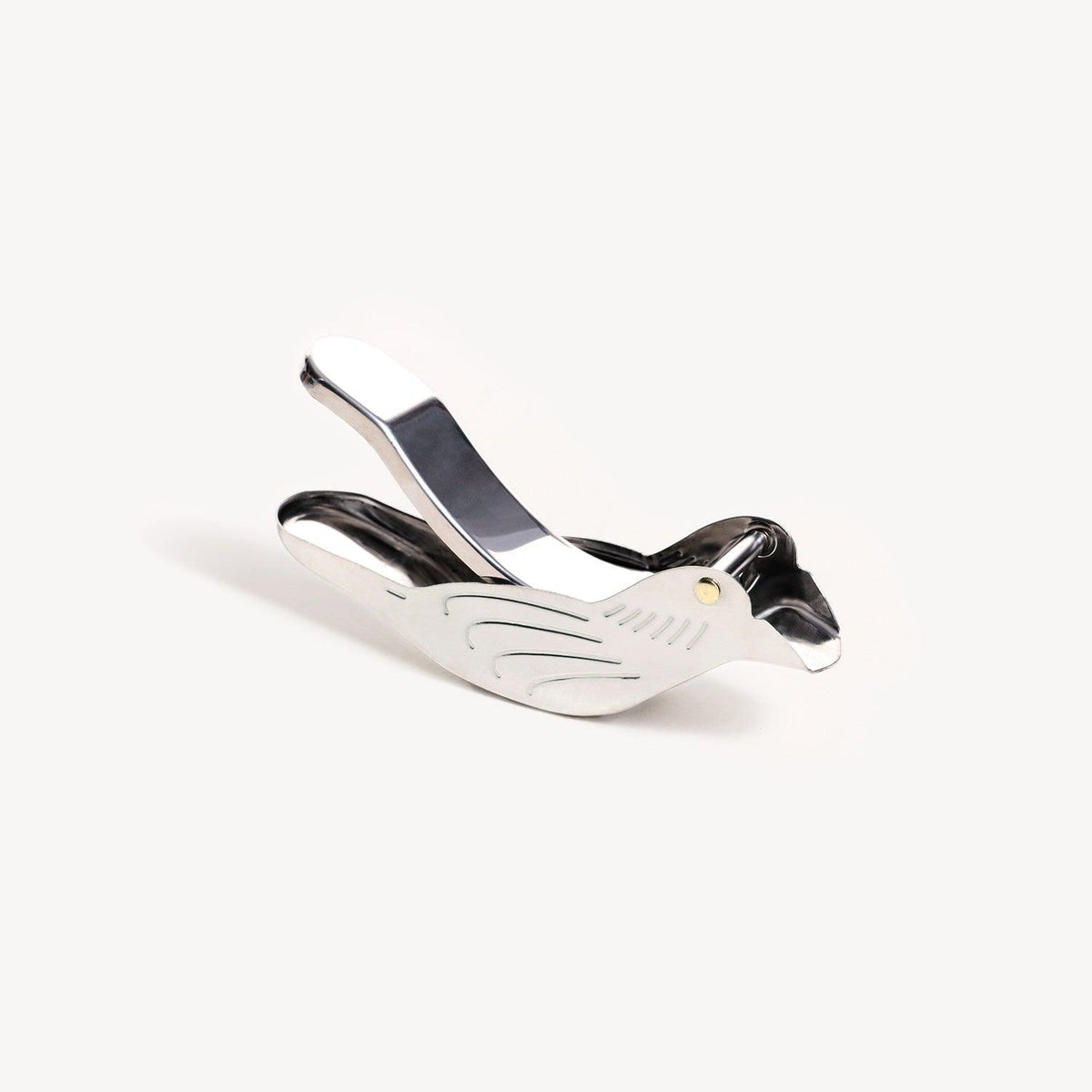 The Octaevo Bird Lemon Squeezer adds a zesty touch, with silver finish and etched feathers for each lemon wedge.