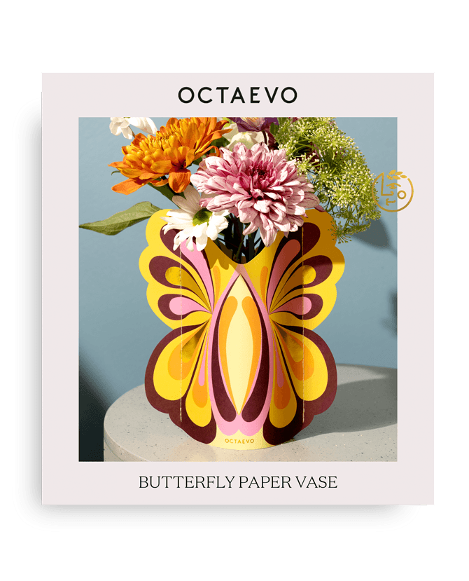 Butterfly Mini Paper Vase by Octaevo, butterfly-shaped with vibrant flowers, comes in branded packaging.