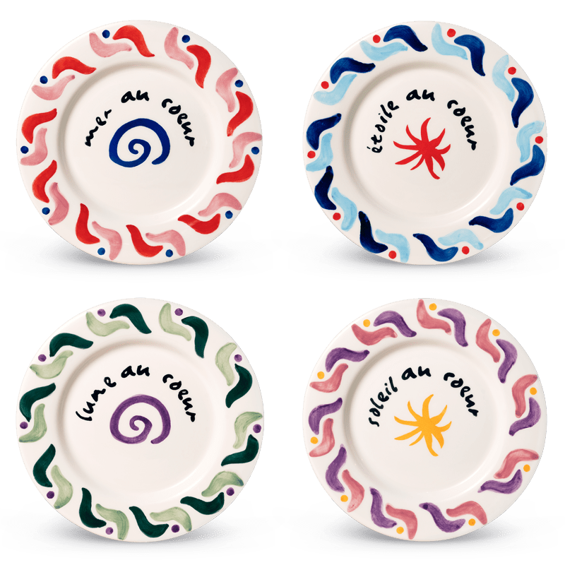 Set of 4 Cala Secreta Plates by Octaevo: colorful ceramics with wavy borders, French phrases, and unique symbols.