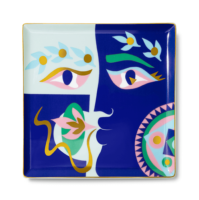The Claire Johnson Ceramic Tray - Blue by Octaevo features an abstract, colorful face with gold foil on a white-blue background.