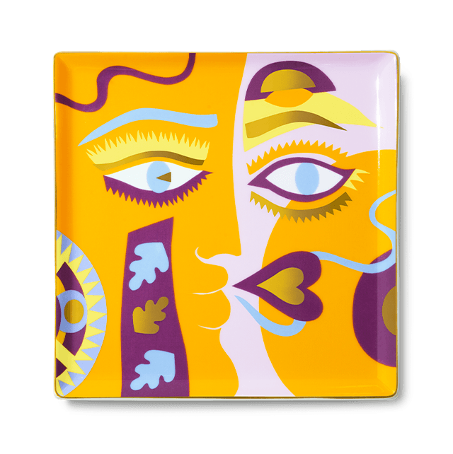 The Claire Johnson Ceramic Tray - Orange by Octaevo features a vibrant abstract face and chic gold foil accents.