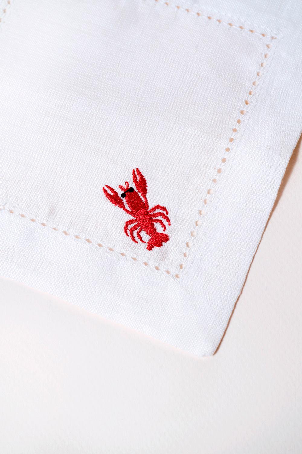 Octaevo’s Cocktail Napkin Lobster, Set of 2 features eco-friendly linen and a red embroidered lobster for stylish entertaining.