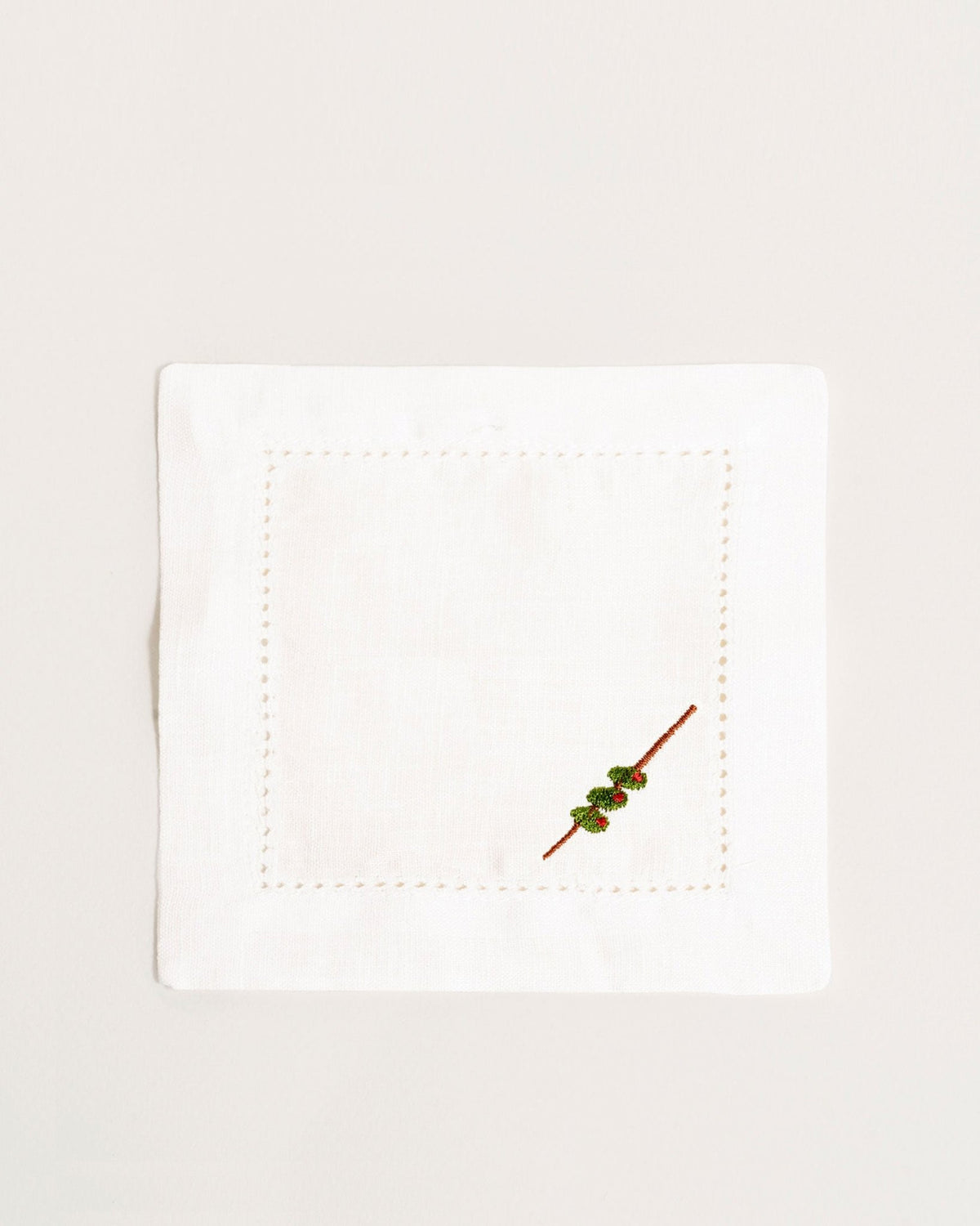 Octaevo Cocktail Napkin Olive, Set of 2: White linen napkins with stitched borders and an olive branch embroidery.