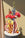 Decorative red OCTAEVO fish-shaped vase with colorful flowers. 