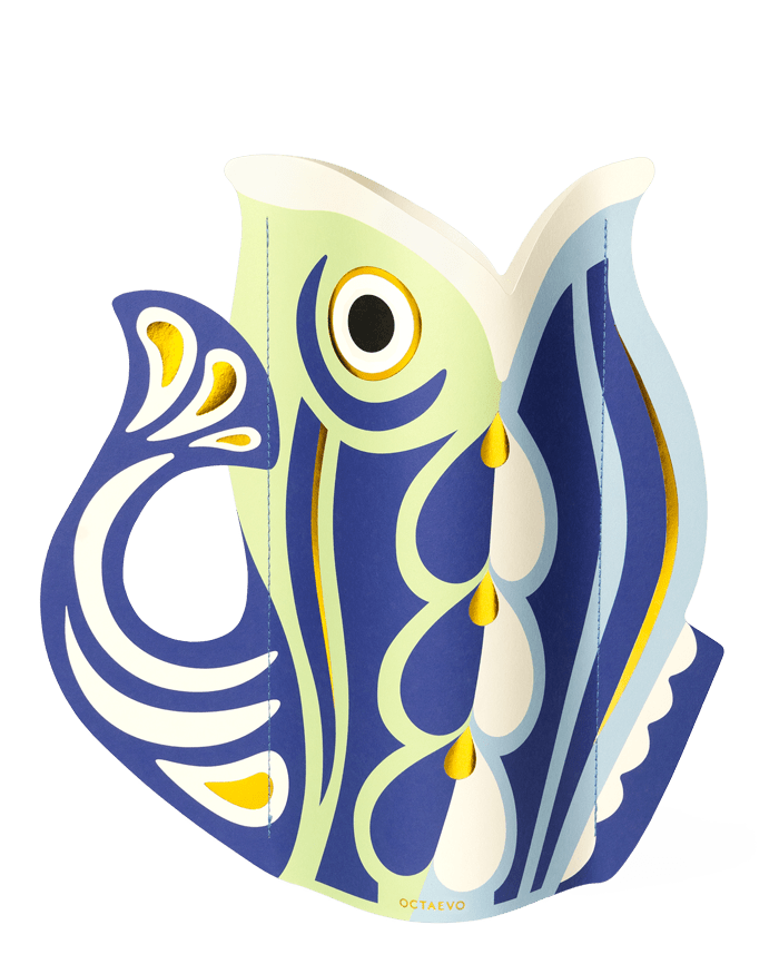 The OCTAEVO Fish Paper Vase features bold Mediterranean-inspired abstract patterns in a stylized fish shape.