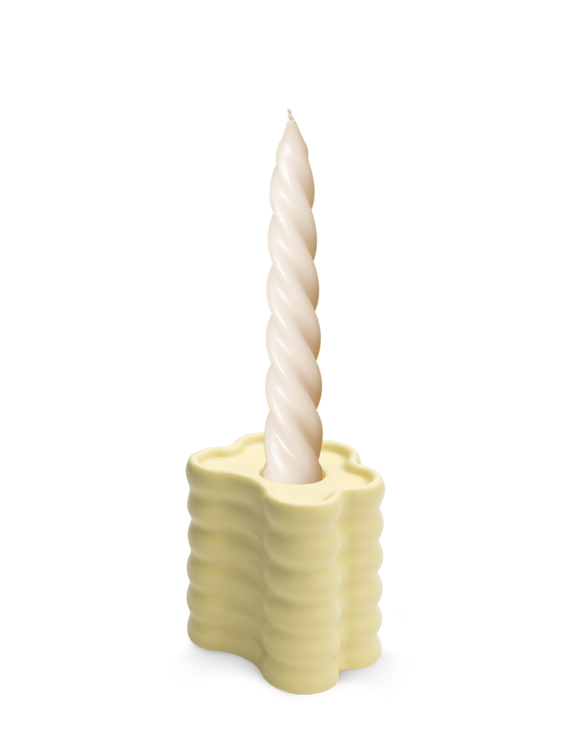 A twisted white sits in an OCTAEVO Flora Candle Holder in Yellow, its wavy ceramic design shown on a plain white background.