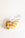 The OCTAEVO Glass Conch Shell Sculpture features hand-blown glass with yellow and white stripes; a striking paperweight.