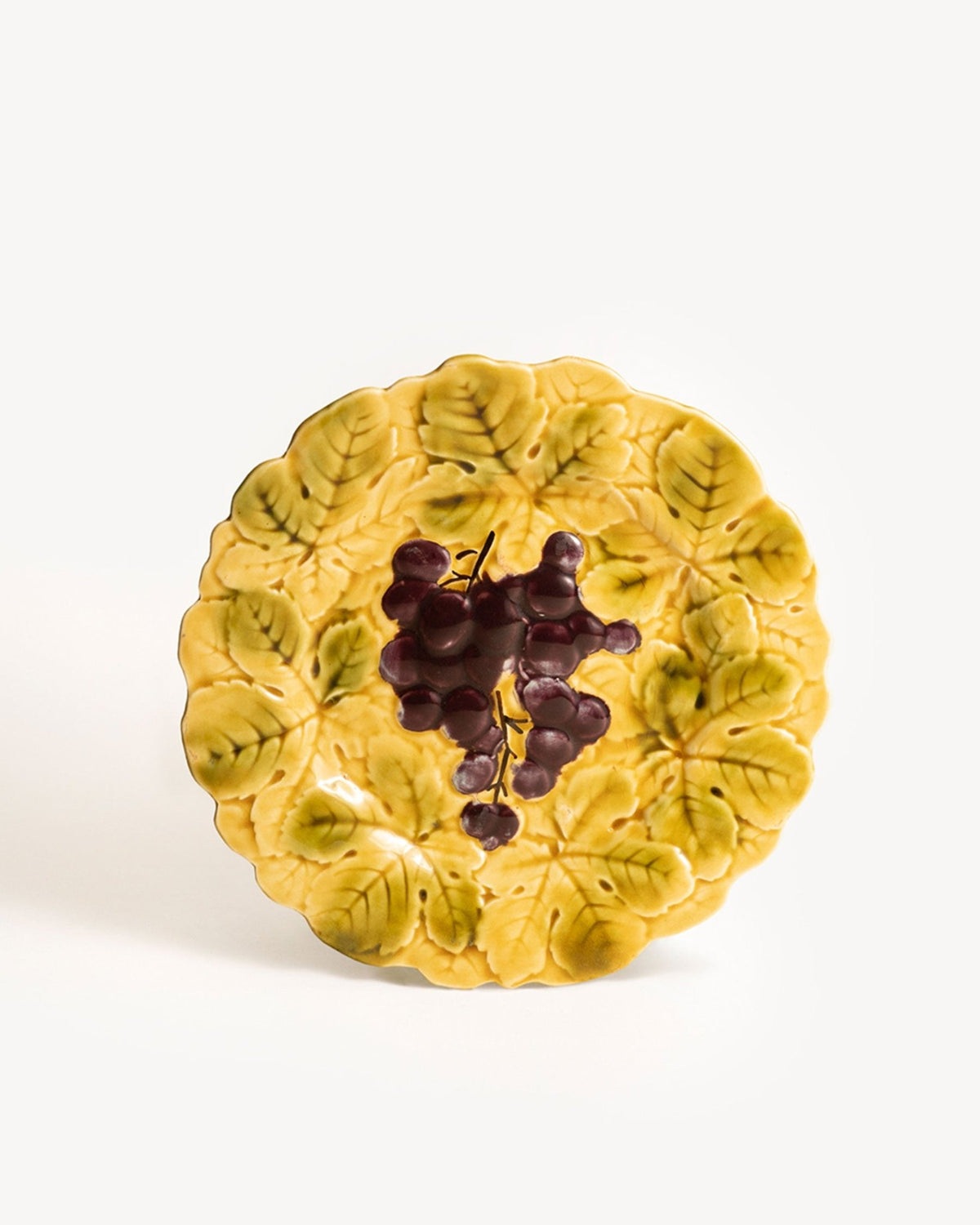 OCTAEVO Grape Majolica Plate features embossed leaves and purple grapes in an Art Nouveau-inspired design.