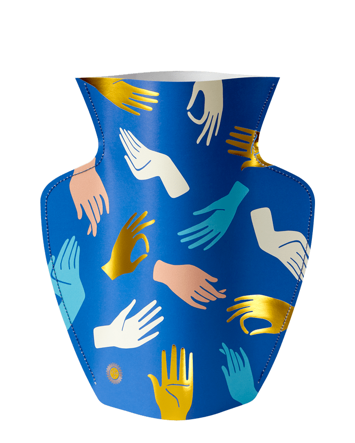 The Hamsa Paper Vase by OCTAEVO features colorful hand motifs in gold, white, pink, and teal on blue paper.