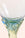 Close-up of the stem and base of Octaevo Iridescent Glass Goblets, Set of 2, with green and blue hues.