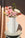 The OCTAEVO Lido Paper Vase with a grid design displays pink and white flowers on a sunlit round table.