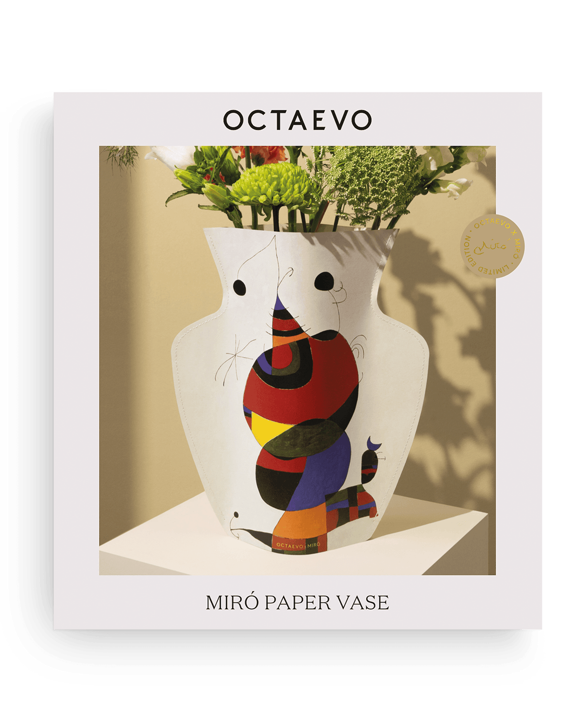 Colorful OCTAEVO paper vase, Miró—Femme, oiseau, étoile, with abstract shapes and flowers.
