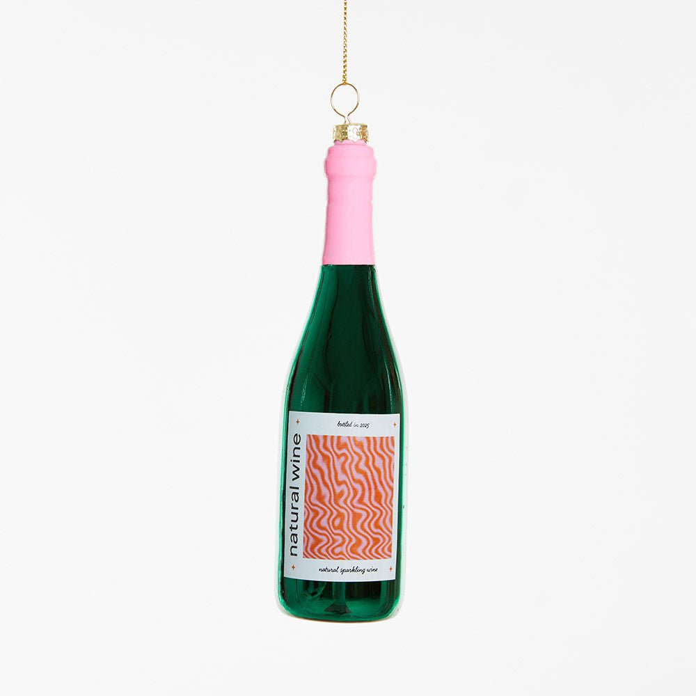 OCTAEVO's Natural Wine Ornament: bottle-shaped with a pink top, wavy label, and gold hanging string.