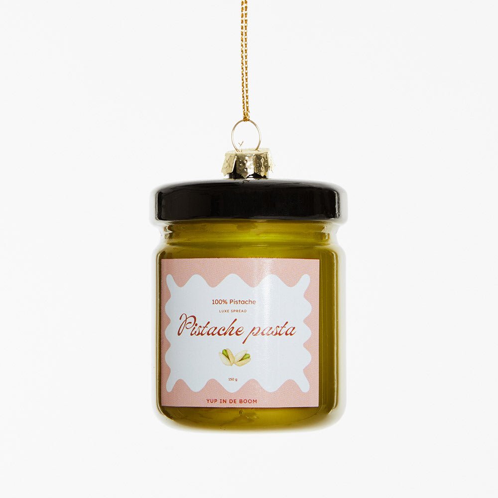 OCTAEVO Pistachio Paste Ornament—a glass jar-shaped ornament with gold hanging string, shown on a white background.
