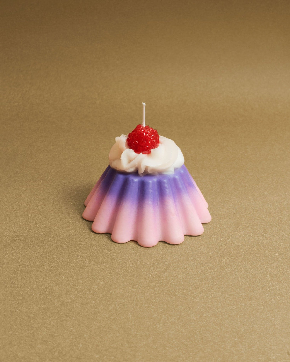 Octaevos Pudding Dessert Candle is shaped like pink and purple jelly with white frosting and a raspberry—perfect decor.