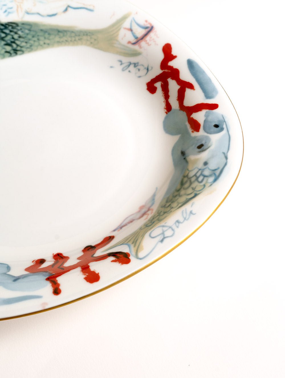 OCTAEVO Salvador Dalí Mermaid Plate—porcelain, red figures, fish, signature; a collectible masterpiece.