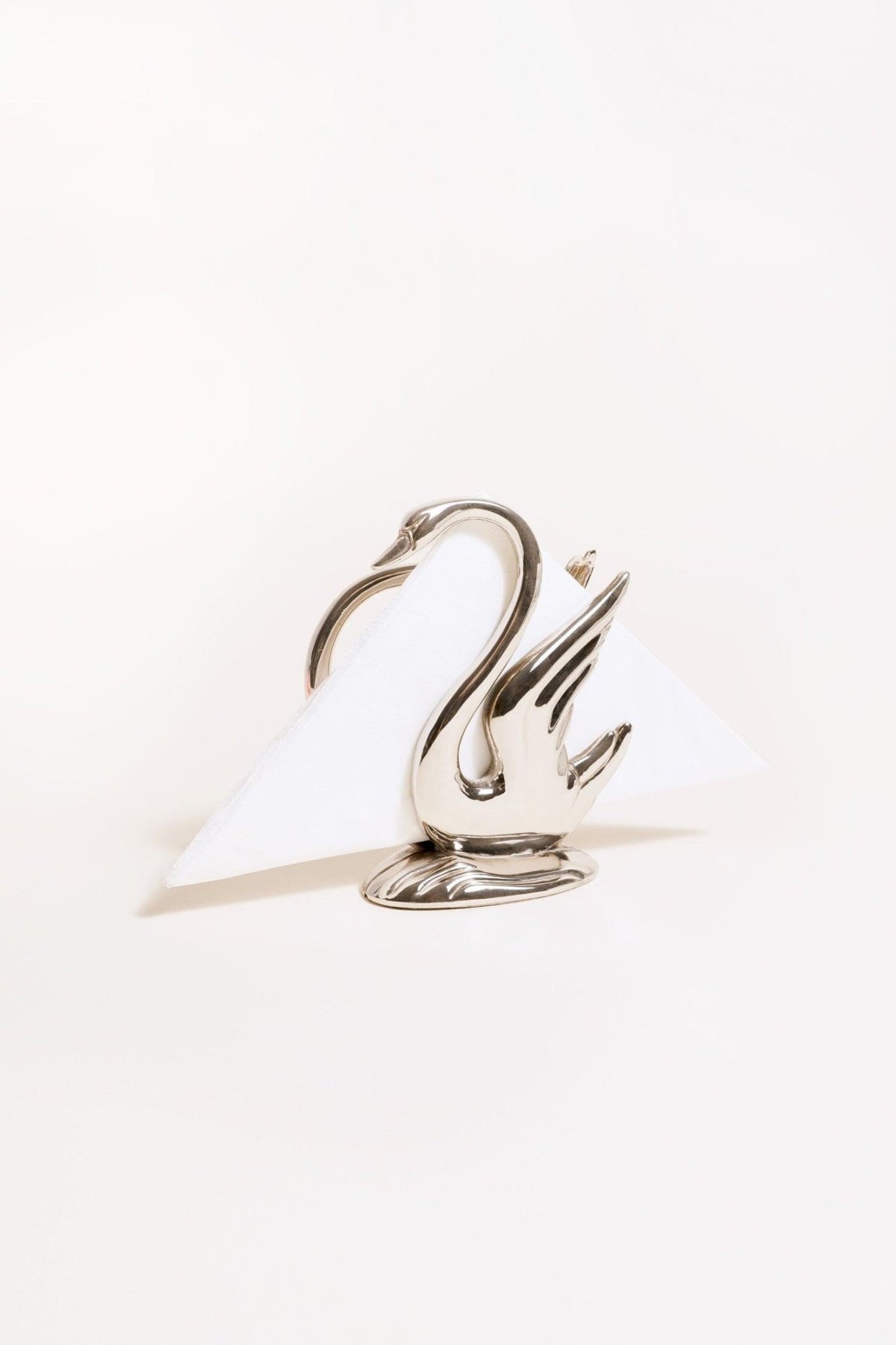 The Octaevo Swan Napkin Holder displays a folded white napkin against a plain white background.