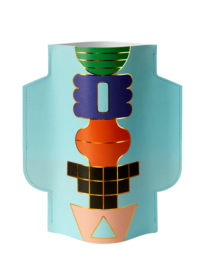 The OCTAEVO Templo Paper Vase is light blue with abstract geometric shapes and gold accents vertically on the front.