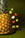Octaevo’s Tutti Frutti Cocktail Picks (Set of 4) hold vibrant fruits, styled against a bold green background.