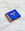 A blue OCTAEVO Apollo Matches box with gold foil accents sits on white marble, partially open with matches visible.
