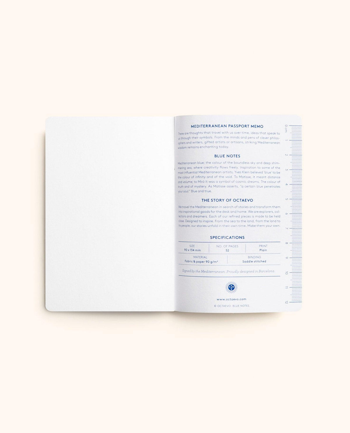 An open OCTAEVO Blue Passport Notes notebook displays a blank page and a page with Yves Klein blue details.