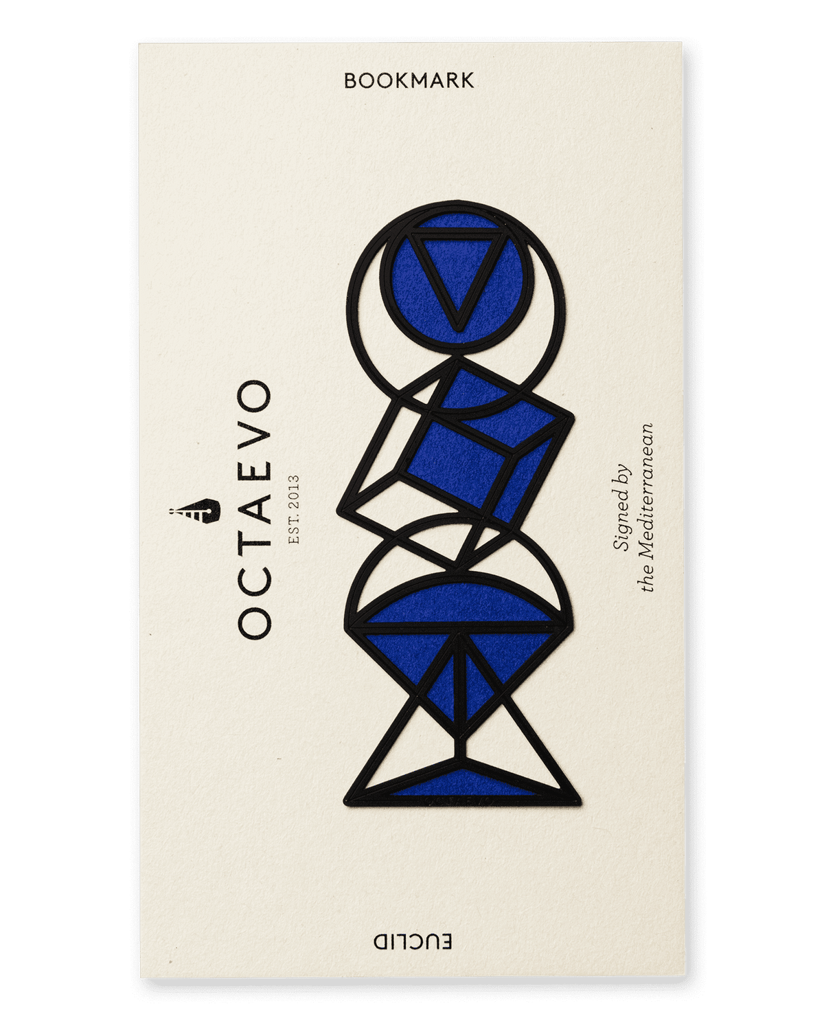 The OCTAEVO Bookmark Euclid is a black geometric brass bookmark on a beige card.