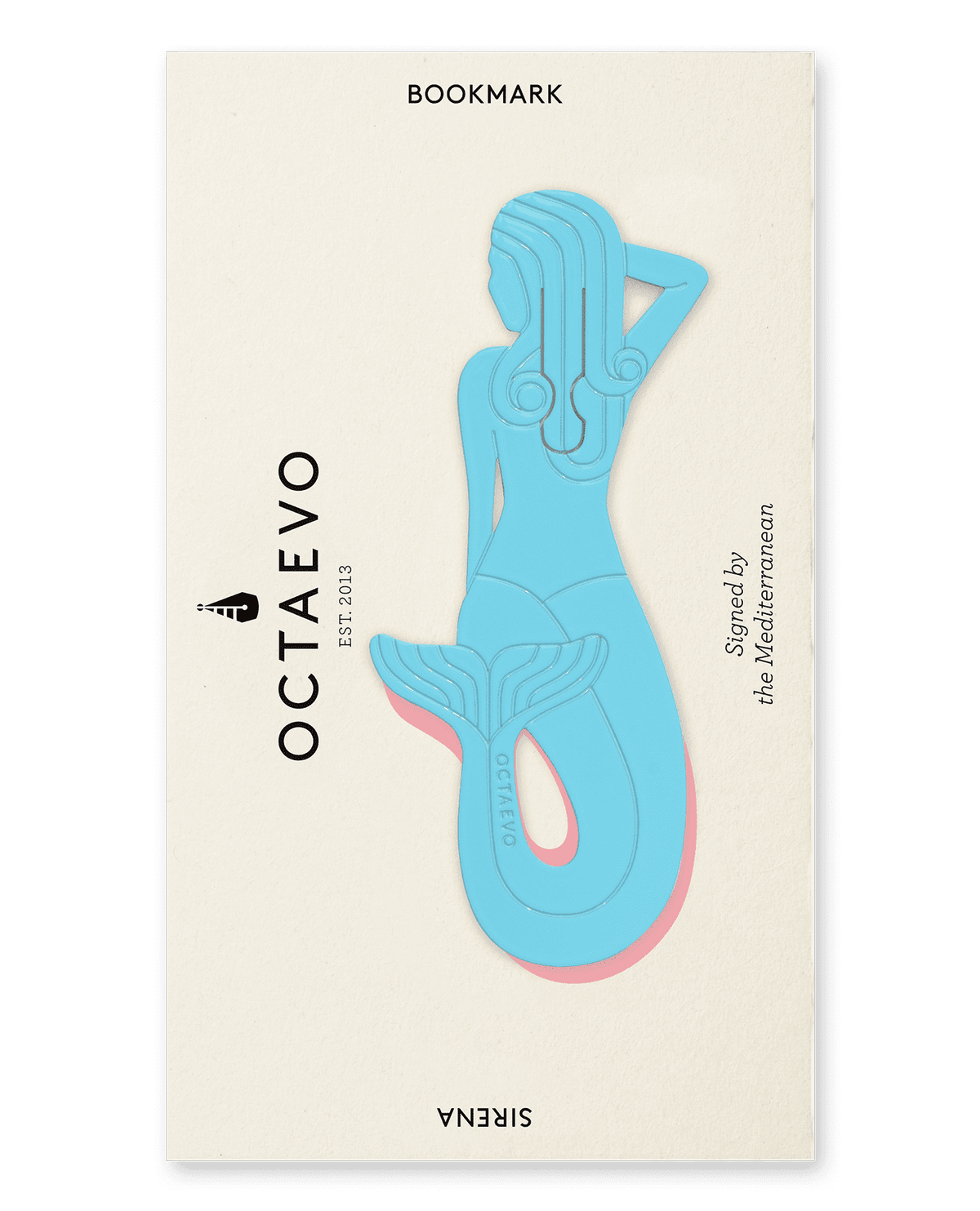 The Bookmark Sirena by OCTAEVO is a light blue brass mermaid resting on a cream card, Signed by the Mediterranean.