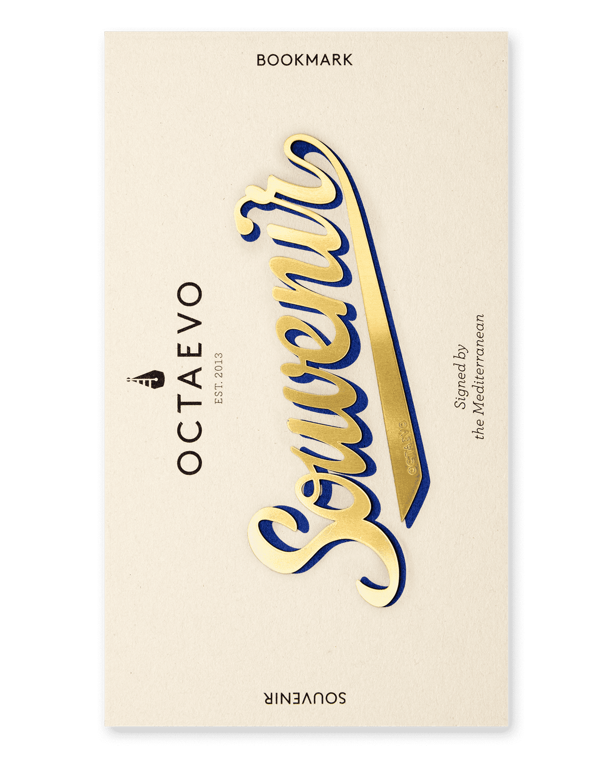 The OCTAEVO Bookmark Souvenir is a gold bookmark, ideal for marking pages or collecting mementos.
