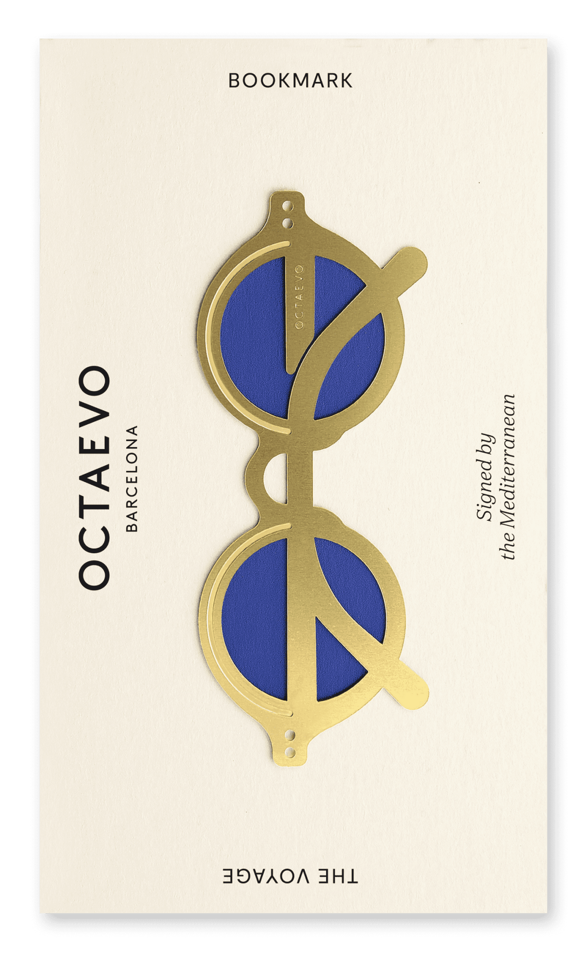 Gold brass Bookmark The Voyage by OCTAEVO, inspired by Mediterranean Rivieras, on a cream card.
