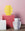 Two Dendra Paper Vases by OCTAEVO, in yellow and white, pop against a pink backdrop with geometric pedestals.