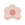A pink, flower-shaped Octaevo Flora Candle Holder viewed from above. 