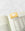 The OCTAEVO Greeting Card Airmail, a stylish yellow envelope bookmark, clips the corner of an open book.