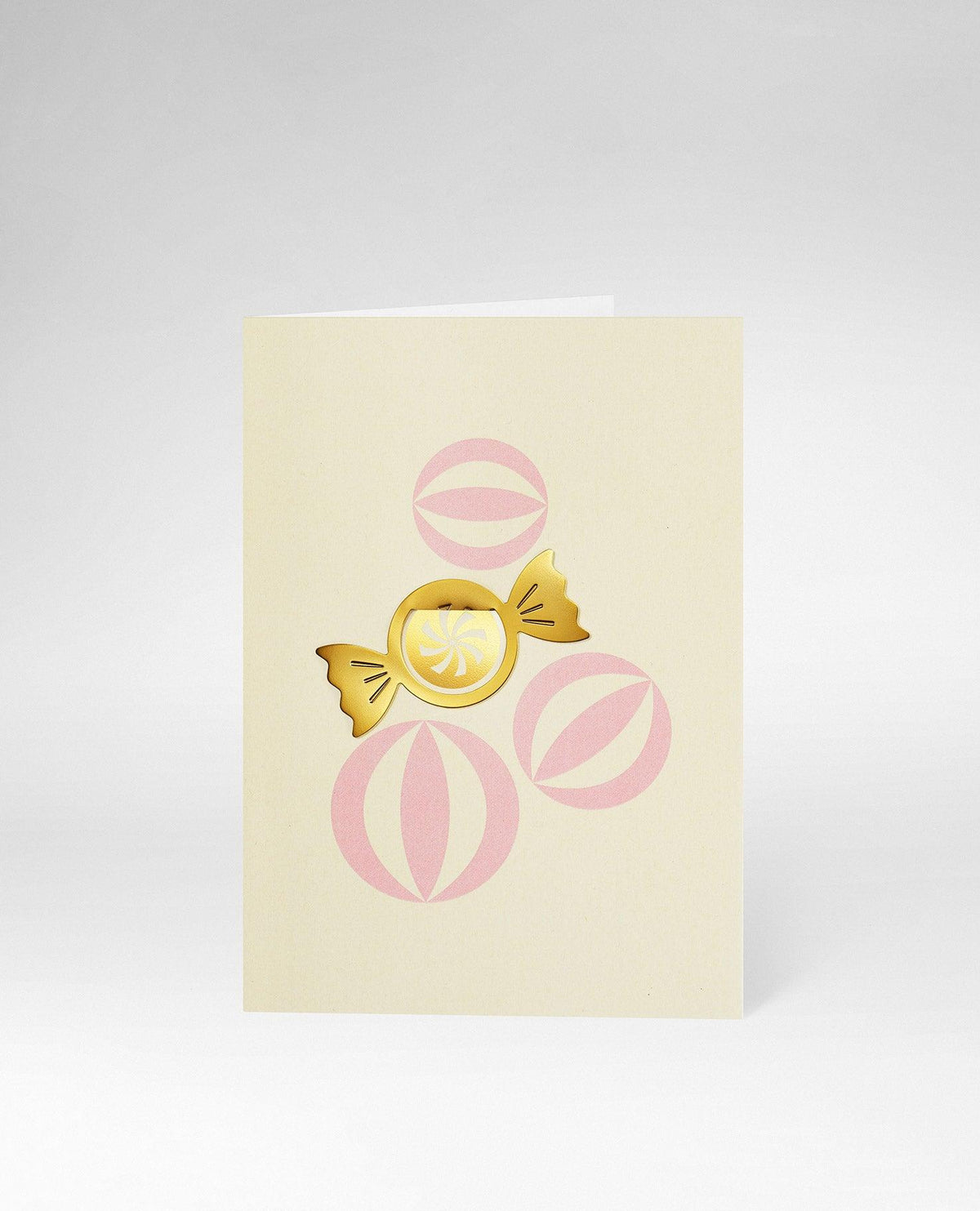 OCTAEVO Greeting Card Candy: cream-colored card with three pink circles and a gold candy clip in the center.