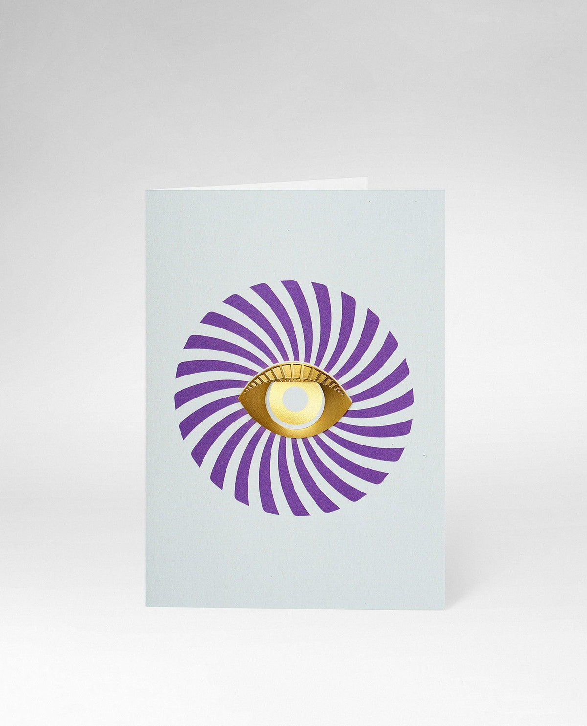 OCTAEVOs Greeting Card Eye features a golden eye and swirling purple lines—ideal for unique stationery. 
