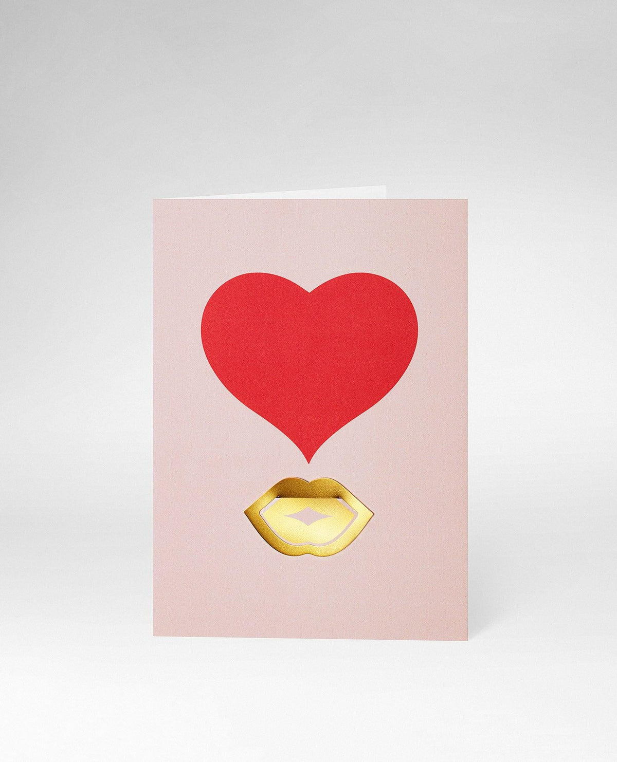 OCTAEVO Greeting Card Kiss features a bold red heart and gold lips on pink—ideal for stylish stationery lovers.