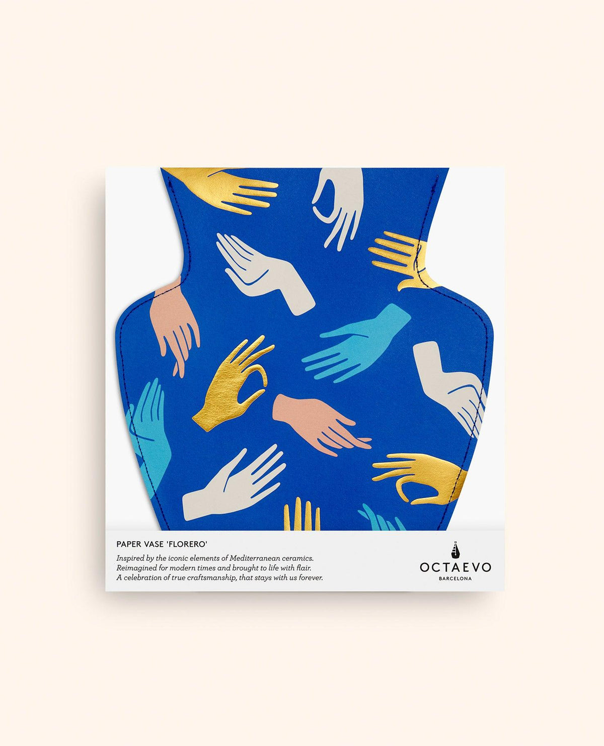 The Hamsa Paper Vase by OCTAEVO features colorful hand motifs on blue, shown against a light beige background.