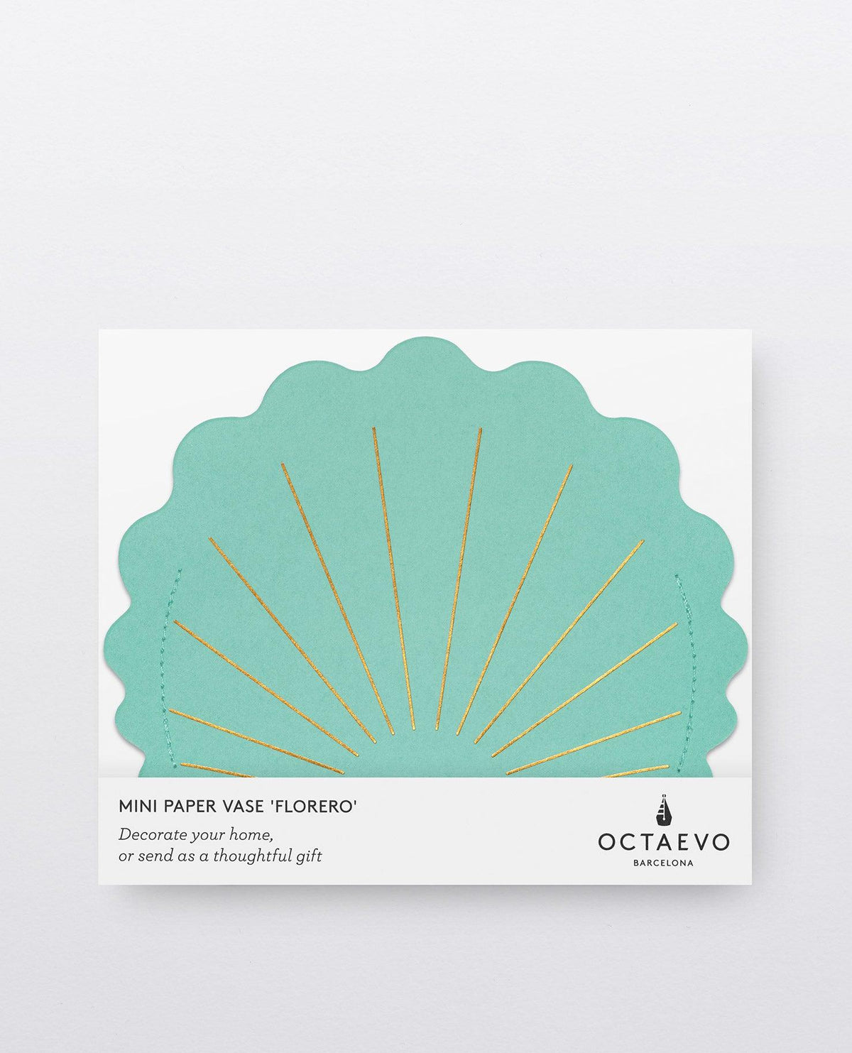 A turquoise, scallop-shaped Hera Mini Paper Vase by OCTAEVO with gold lines, in white “OCTAEVO” packaging.