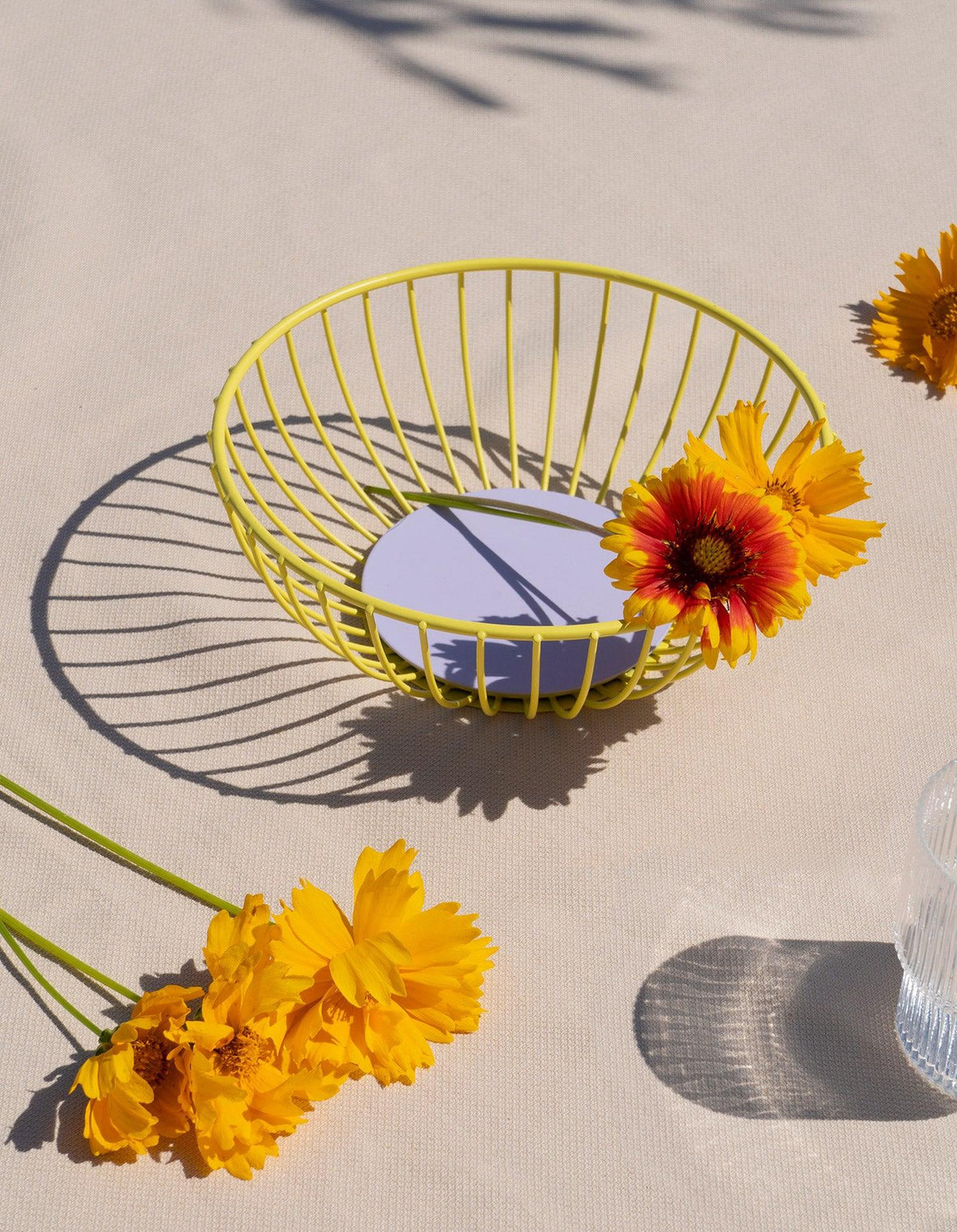 The yellow Iris Wire Basket by OCTAEVO adds a sculptural, sunny touch to contemporary home decor.