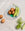 The Iris Wire Basket by OCTAEVO with brown eggs and bitter melons creates a modern sculptural home centerpiece.