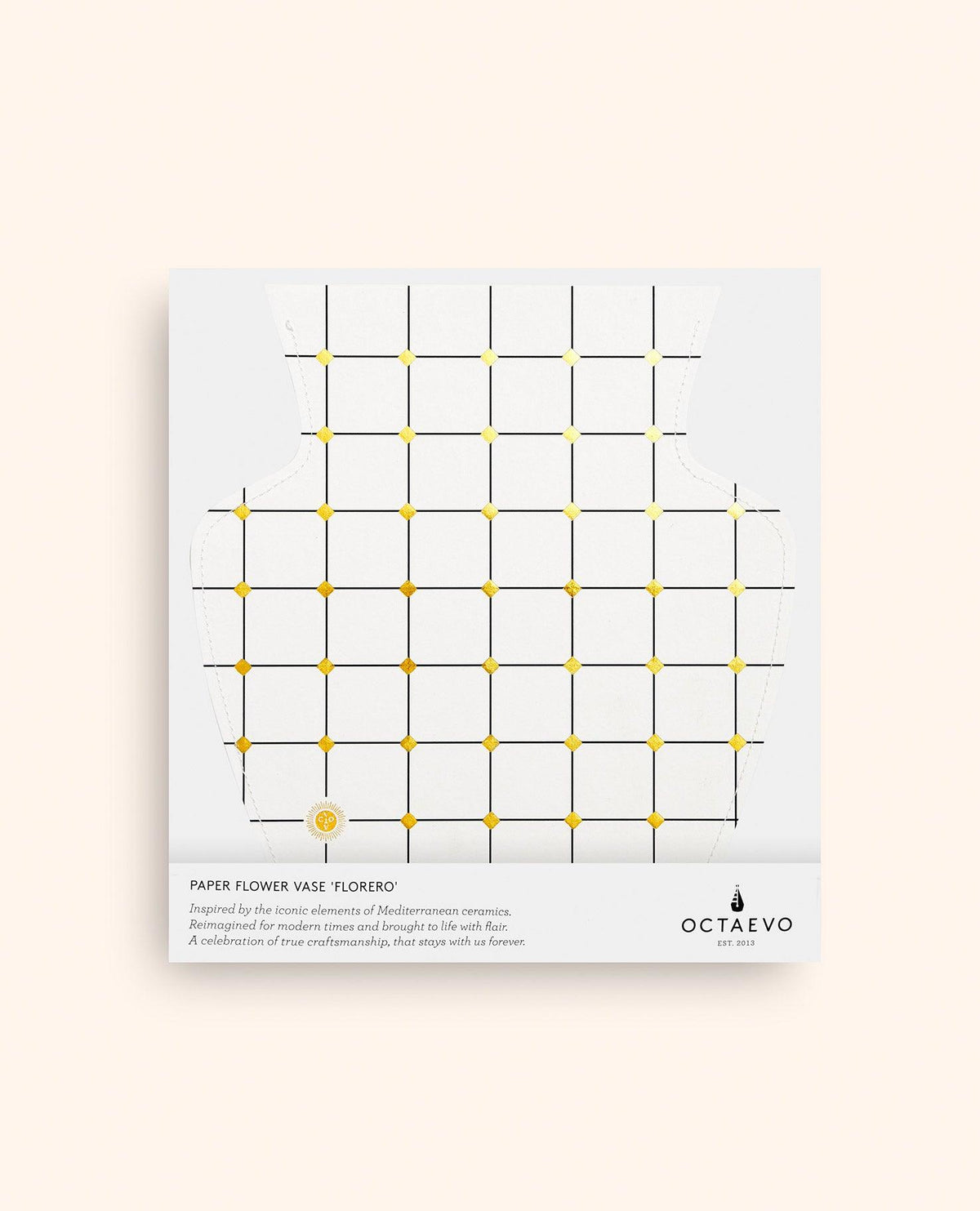 The white Lido Paper Vase by OCTAEVO is flat, handcrafted vase with a grid and gold dots on beige.