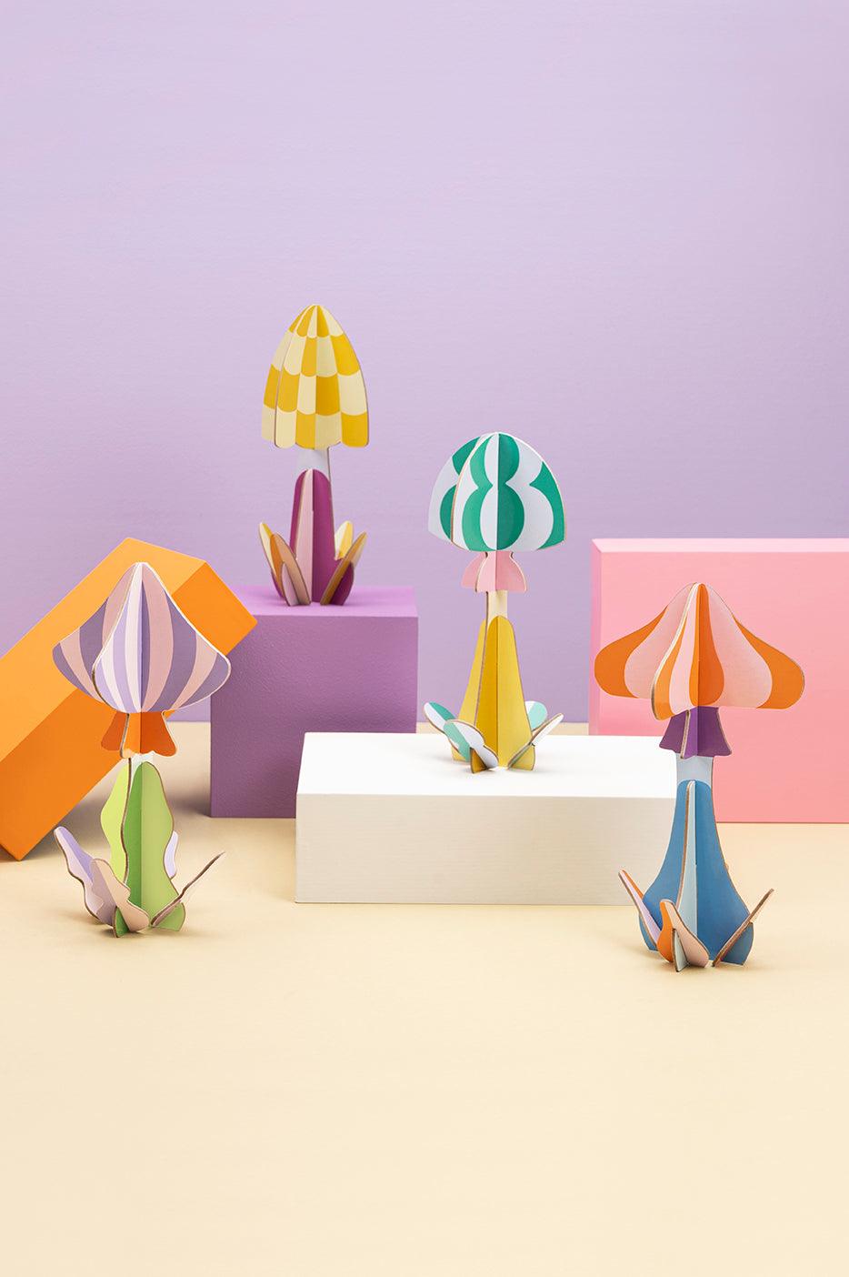 The Woodland Mushroom Paper Sculpture by OCTAEVO features vibrant recycled cardboard, ideal for unique home decor.